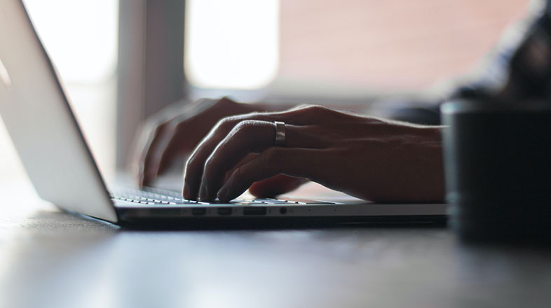 Accountant typing on a computer