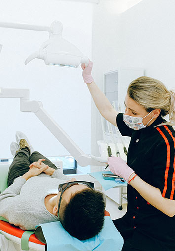 Dentist Examining Patient