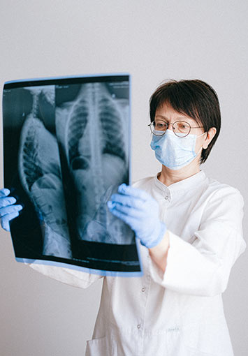 Doctor examining an x-ray image in a medical setting