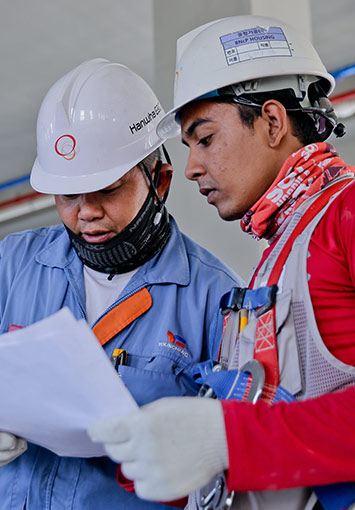 Construction workers reviewing documents