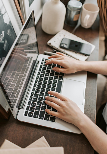 Person using a document management system on a laptop.