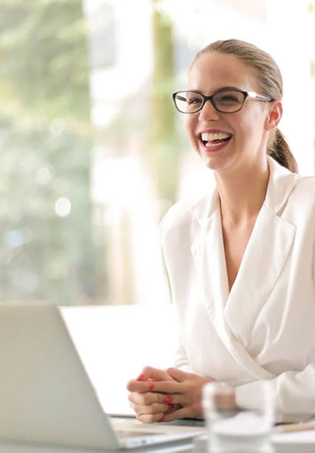 Woman using a computer at work planning digital storage costs