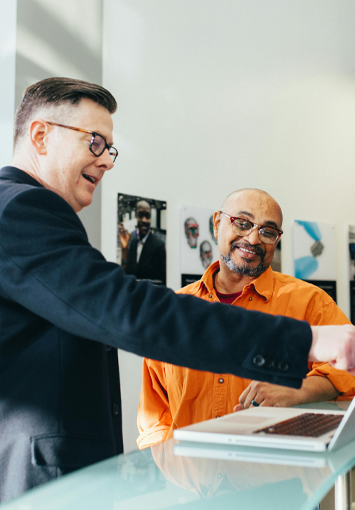 A boss working closely with his employee