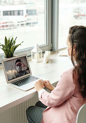 Woman receiving telehealth medicine from her doctor.