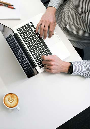 Worker Reviewing Documents on a Computer