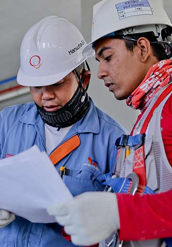 Workers reviewing construction documents