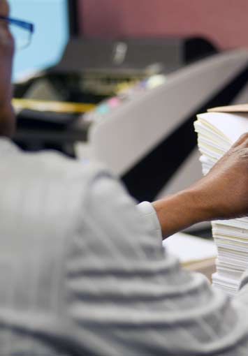 SecuresScan Staff Member Preparing to Scan Documents
