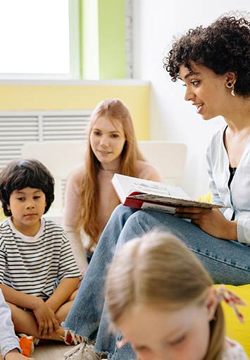 Teacher working with students in a classroom setting