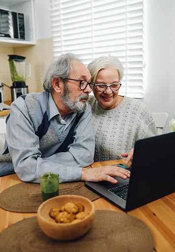 Older couple viewing an accessible PDF on a computer