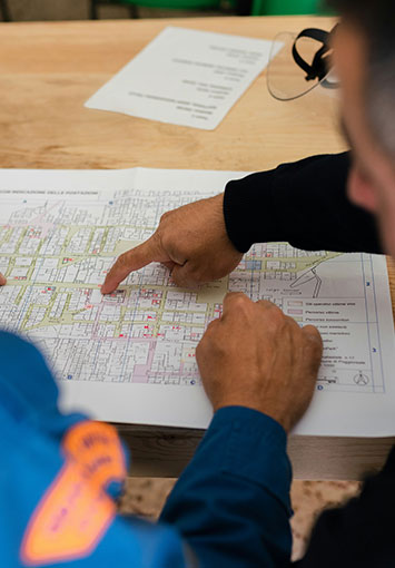 Two engineers reviewing an engineering drawing
