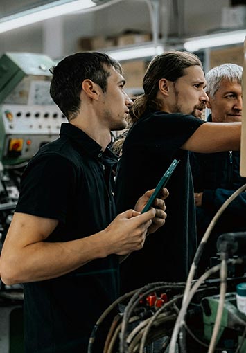 Manufacturing Plant Employee Working On Equipment